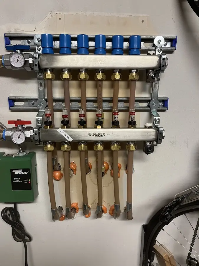 Plumber performing Water Heater Repair at a residential property in Edinboro