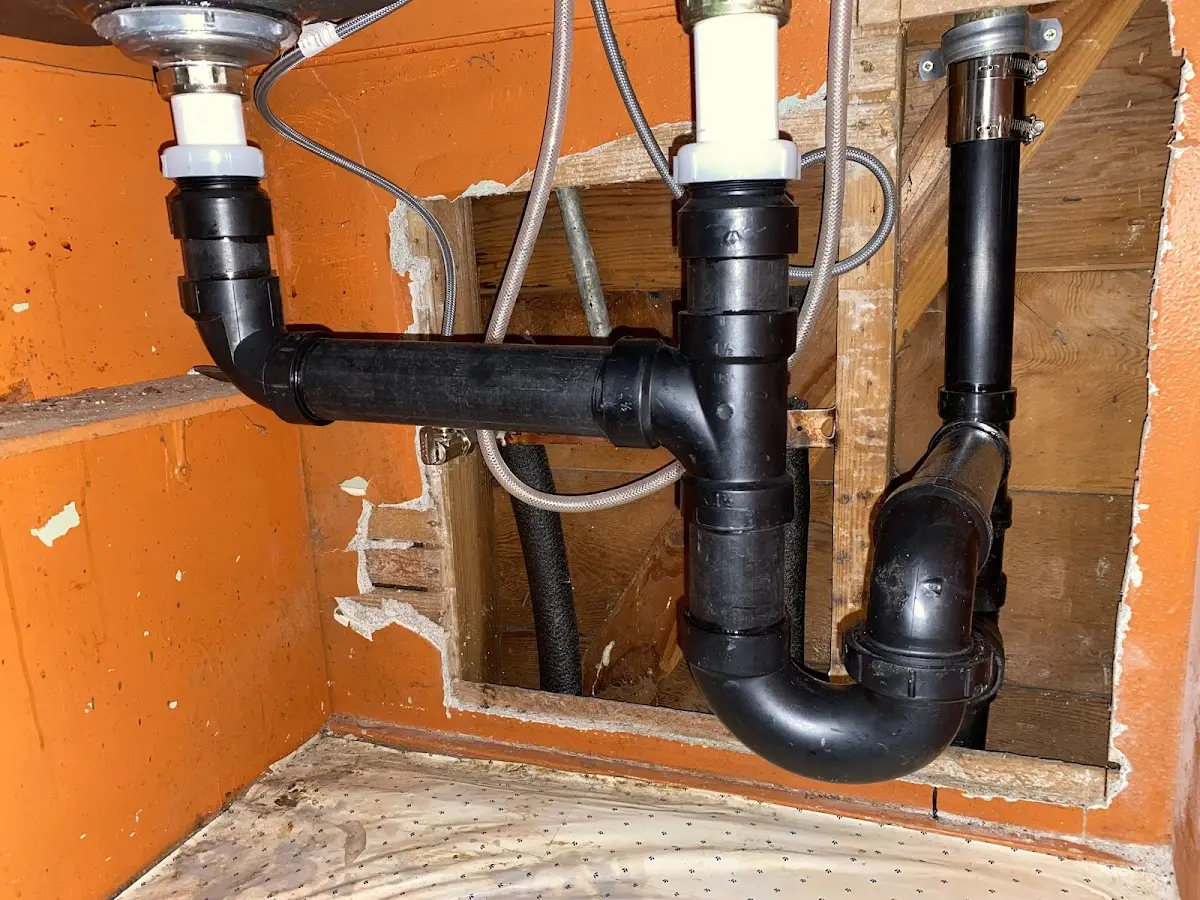 Professional Garbage Disposal Repair equipment and tools on the job in Edinboro